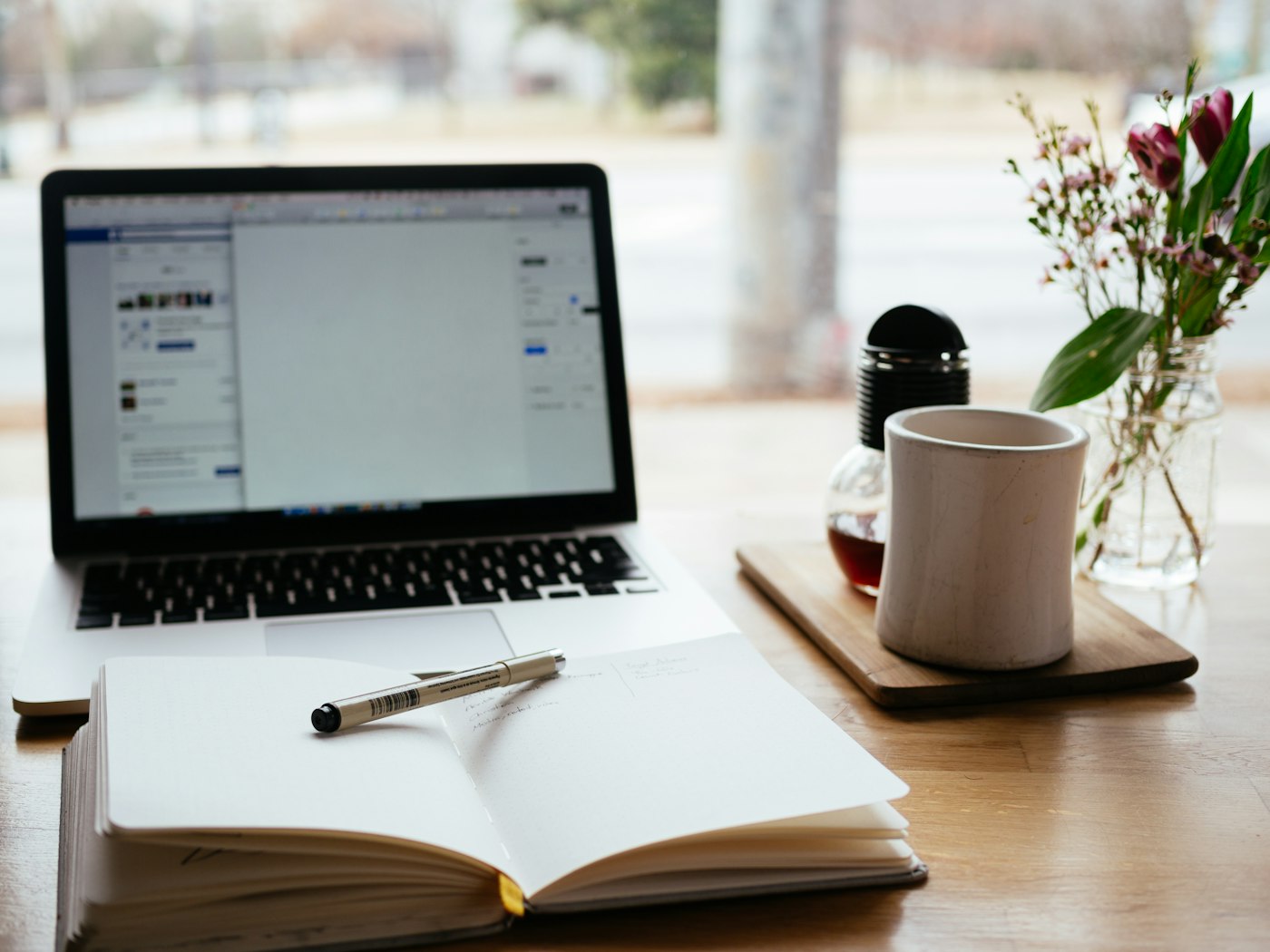 Laptop, notebook and coffee on a calm desk