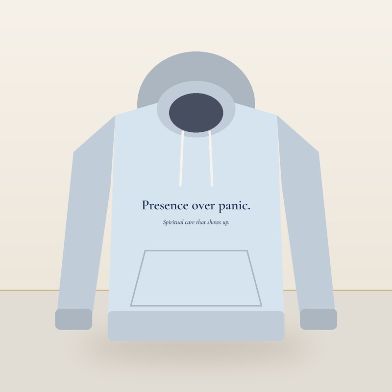 Light blue hoodie printed with Presence over panic. Spiritual care that shows up.